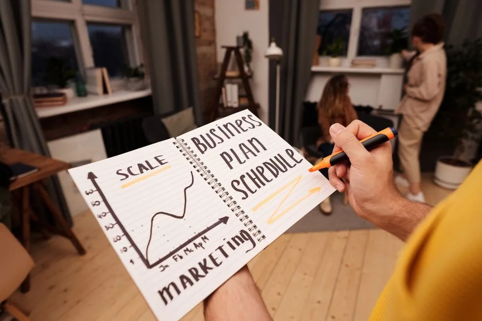 Close-up of a notebook page with Social Media Marketing handwritten on it.